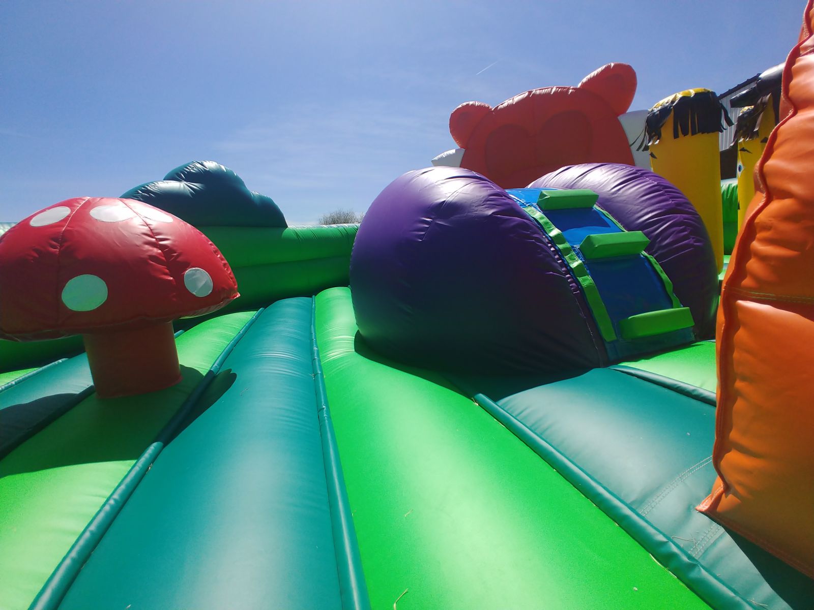 Toddler climbing wall and slide within toddler playland bounce house rental